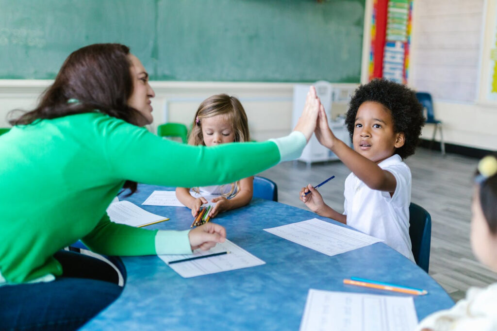 Image of teacher and a children at school