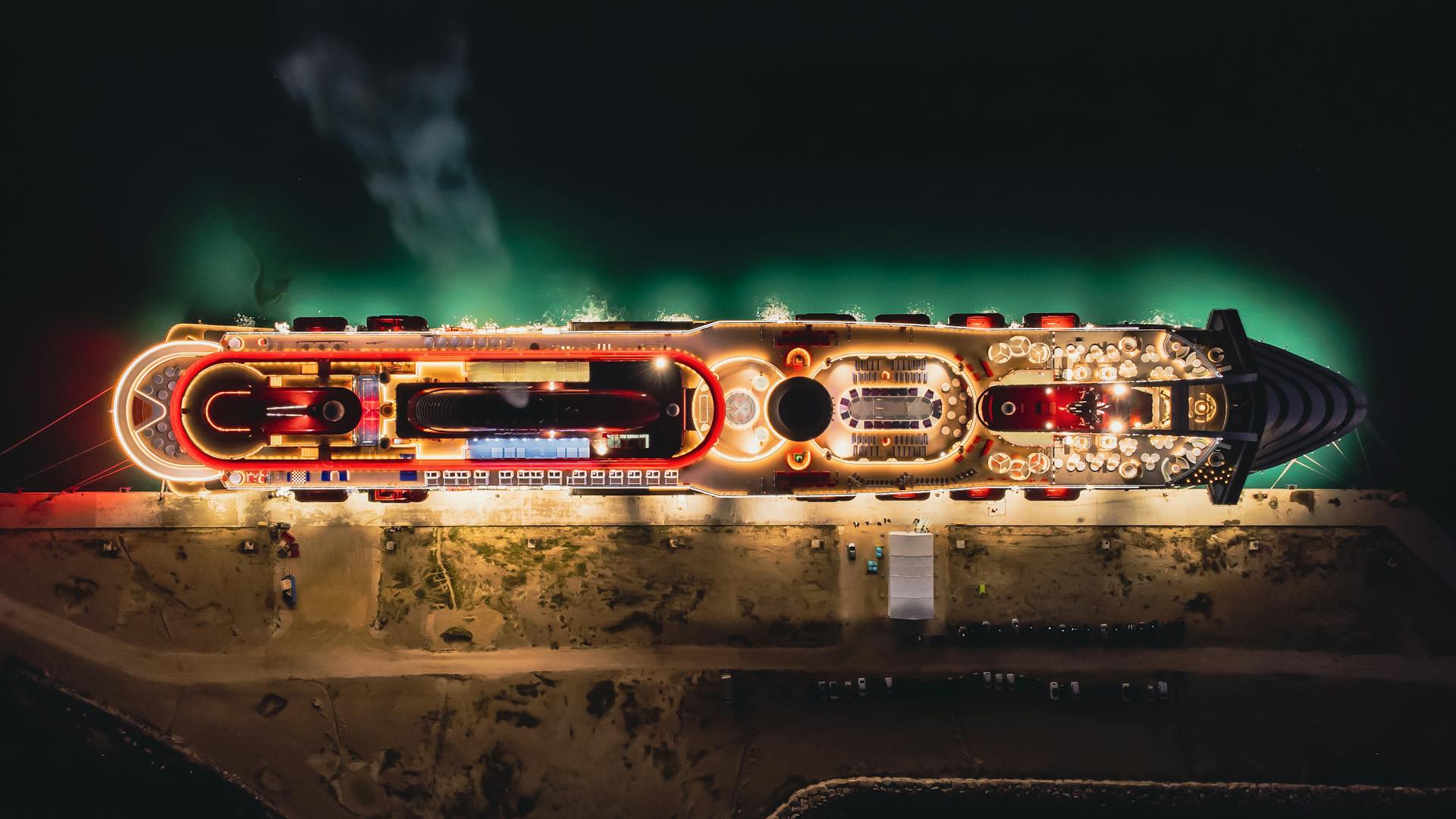 Image of Cruiseship at the sea at night with lights over view drone view